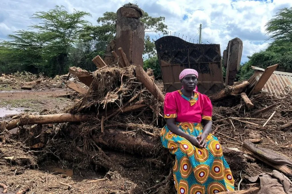 Nancy Wanjiku sits on what is left of her parents' home