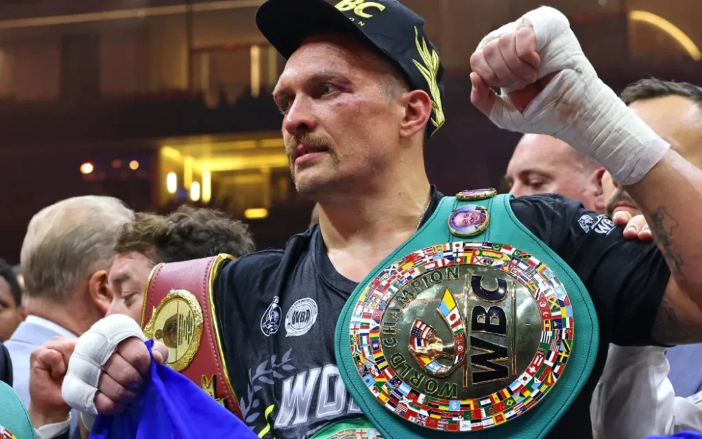 Ukraine's Oleksandr Usyk celebrates his victory over Britain's Tyson Fury during a heavyweight boxing world championship fight at Kingdom Arena in Riyadh, Saudi Arabia
